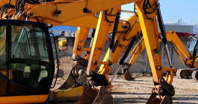 heavy machinery lined up on a construction site